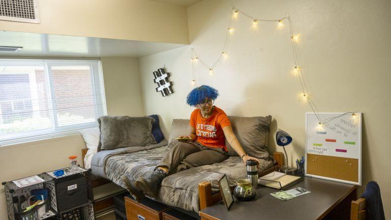 student in dorm room